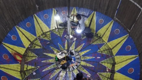 Central Java, Indonesia. April 15,2024: The attraction of the rotating motorbike Stock Footage 274830049