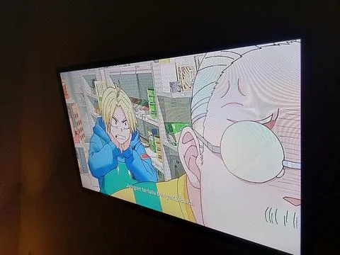 Central Java Indonesia April 27, 2025: watching on tv anime Sakamoto days. Stock Photos