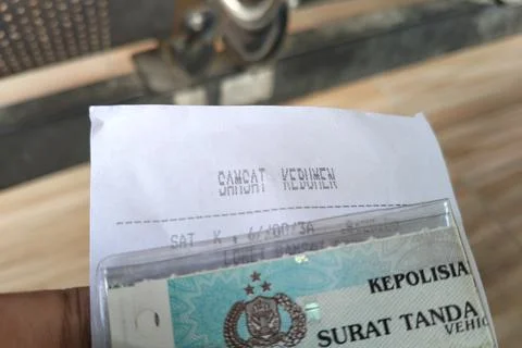 Central Java Indonesia April 29 2026: Close-up of a queue number ticket held by  Fotos Stock