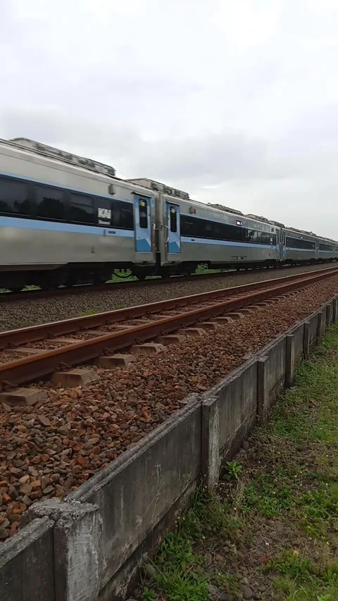 Central Java Indonesia April 4, 2025: a train passing on the tracks. Stock Footage 306722354