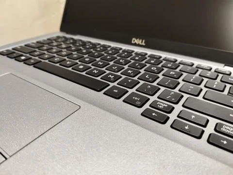 CENTRAL JAVA, INDONESIA - AUG 04, 2026: Close up of a silver Dell laptop keyboar Stock-Fotos