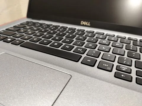 CENTRAL JAVA, INDONESIA - AUG 04, 2026: Close up of a silver Dell laptop keyboar Stock-Fotos