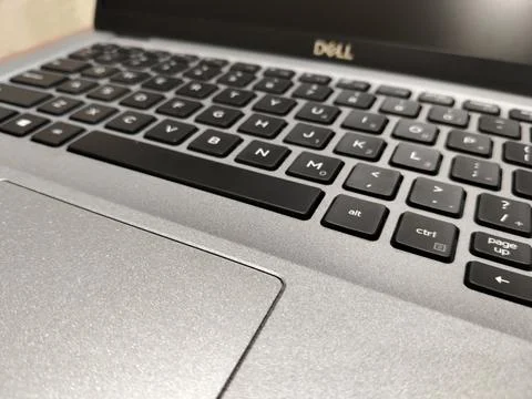 CENTRAL JAVA, INDONESIA - AUG 04, 2026: Close up of a silver Dell laptop keyboar Stock-Fotos