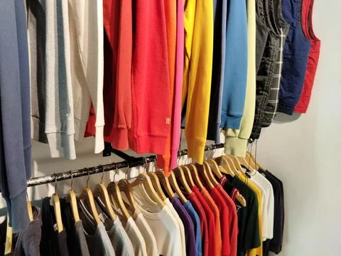 CENTRAL JAVA, INDONESIA - AUG 11, 2026: Colorful sweaters and vests hanging on a Stock Photos
