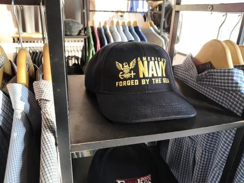 CENTRAL JAVA, INDONESIA - AUG 11, 2026: Black hat with America's Navy text place Stock Photos