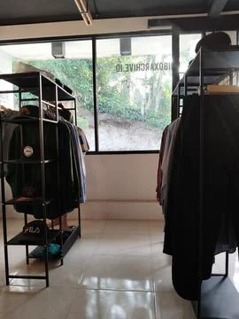 CENTRAL JAVA, INDONESIA - AUG 11, 2026: Interior view of a local thrift shop sho Stock Photos