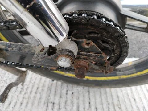 Central Java Indonesia AUG 19, 2026: Close up view of a rusty motorcycle drive c Foto stock