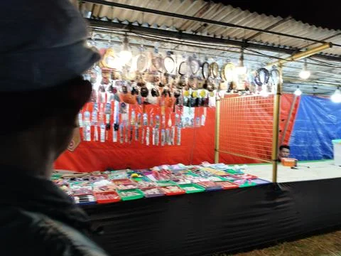 CENTRAL JAVA, INDONESIA - AUG 2, 2026: Over the shoulder view of a person lookin Stock-Fotos