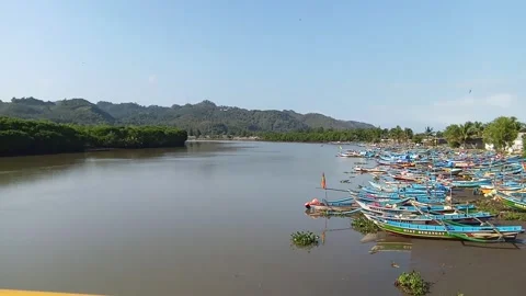 Central Java Indonesia August 1, 2025: fishing boats moored in the river Stock Footage 314277891
