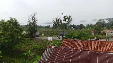 Central Java Indonesia August 18, 2025: on roofs of buildings and vehicles  Stock Footage 315283209