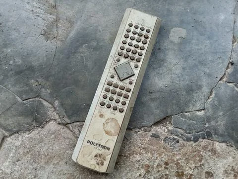 Central Java, Indonesia August 25, 2024: Old remote, on a cement floor. Fotos de archivo