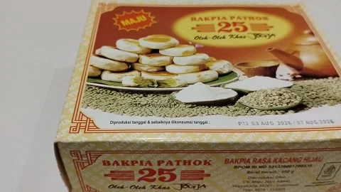 Central Java, Indonesia, August 6, 2026: A box of Bakpia Pathok 25—a famous  Video stock 343549395