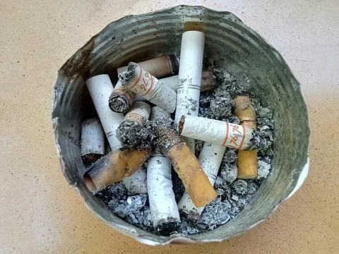 Central Java Indonesia August 6 2024: Cigarette butts in the ashtray. Stockfoto's