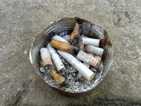 Central Java Indonesia August 6 2024: Cigarette butts in the ashtray. Stockfoto's