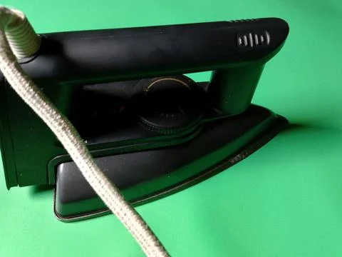 Central Java Indonesia December 28, 2026: Iron on a green background. Фото