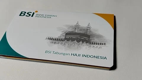Central Java Indonesia February 15, 2026: Bank Syariah Indonesia savings book an 스톡 동영상 329205367