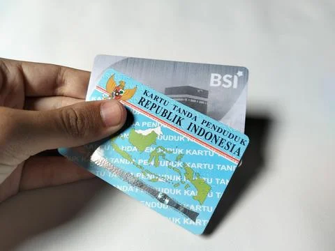 Central Java Indonesia February 15, 2026: A person holding an ID card and a BSI  스톡 사진