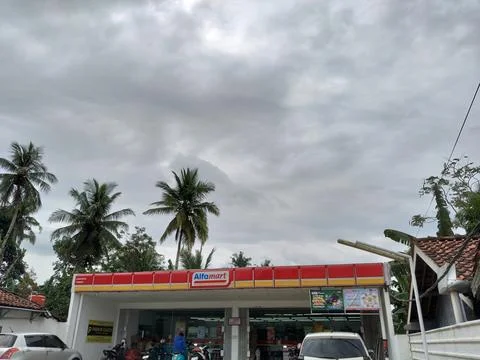 Central Java, Indonesia, February 18, 2026: Exterior of Alfamart minimarket Foto stock