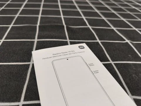 Central Java Indonesia January 14, 2026: user guide and warranty card for Xiaomi Stock-Fotos
