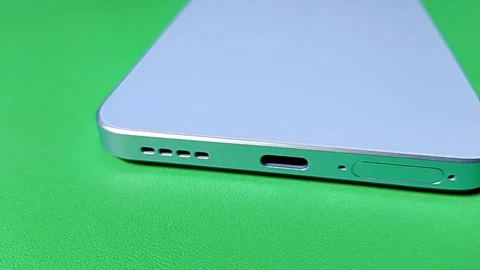 Central Java Indonesia January 30, 2026: Bottom view of the smartphone, speaker, Stock Footage 328524550