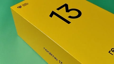 Central Java Indonesia January 30, 2026: New smartphone packaging box, realme 13 Video stock 328524586