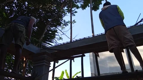 Central Java, Indonesia, July 11, 2025: Workers are assembling the iron frame  Stock Footage 313578380