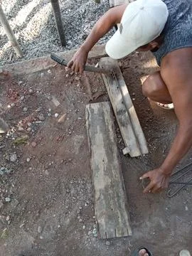Central Java, Indonesia, July 11, 2025: a worker is forming iron for a building  Фото