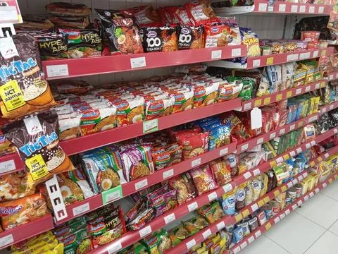Central Java, Indonesia, July 16, 2025: Food and drinks for sale displayed  Фото
