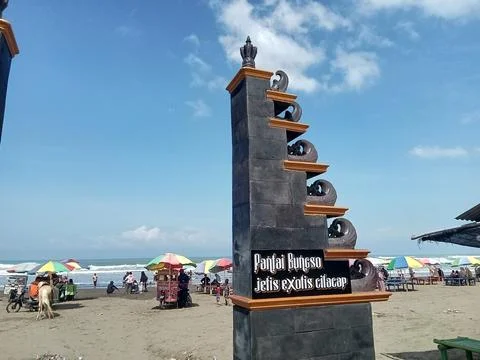 Central Java Indonesia July 7 2024: Landmark entrance monument, jetis beach Фото