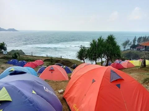 Central Java Indonesia June 18 2024: Camping tents on the Menganti beach hill 스톡 사진