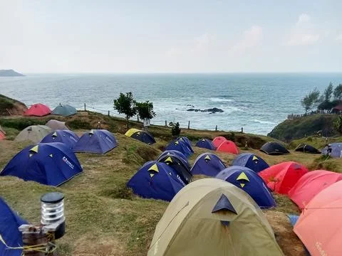 Central Java Indonesia June 18 2024: Camping tents on the Menganti beach hill 스톡 사진