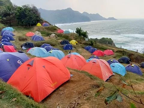 Central Java Indonesia June 18 2024: Camping tents on the Menganti beach hill 스톡 사진