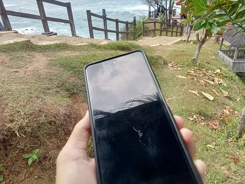 Central Java Indonesia June 18 2024: someone holding a smartphone Фото