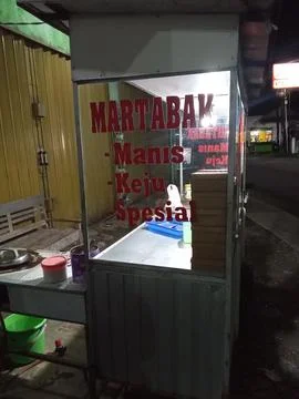 Central Java, Indonesia, June 2025: a sweet martabak vendor's cart on the roadsi Фото