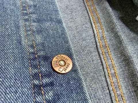 Central Java Indonesia March 14 2024: closeup of a denim jeans jacket. clothing  Фото
