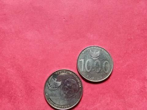 Central java Indonesia March 16 2023: Indonesian coins, Rp.1000 denomination. Stockfoto's
