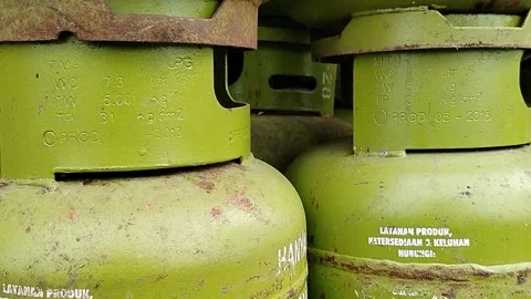 Central Java Indonesia March 5, 2026: Green 3 kg LPG gas cylinder commonly used  Stock Footage 330771381