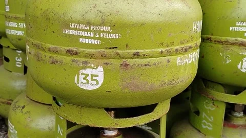 Central Java Indonesia March 5, 2026: Green 3 kg LPG gas cylinder commonly used  Stock Footage 330771394