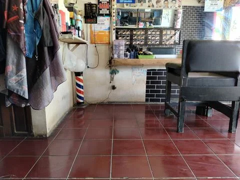 Central Java Indonesia March 6 2026: Interior of a barbershop with barber chair  Stock Photos
