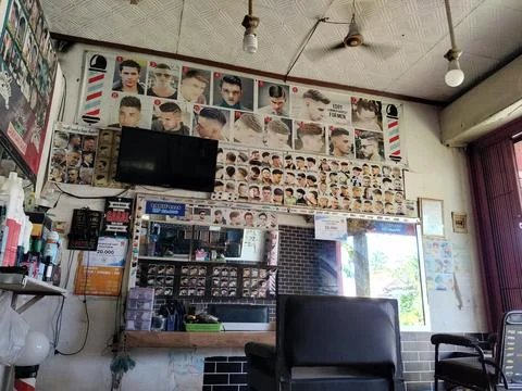 Central Java Indonesia March 6 2026: Interior of a barbershop with barber chair  Stock Photos