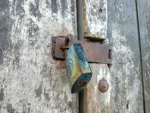 Central Java Indonesia, March 7 2023: a locked door padlock. Фото