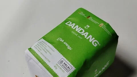 Central Java, Indonesia, May 19, 2026: Unopened green paper packaging of Dandang Stock Footage 335191878