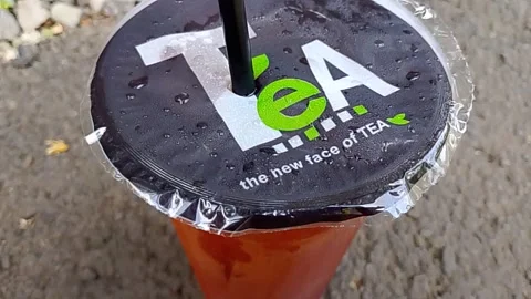 Central Java Indonesia October 16, 2025: sweet iced tea in a plastic cup. Video stock 320353857