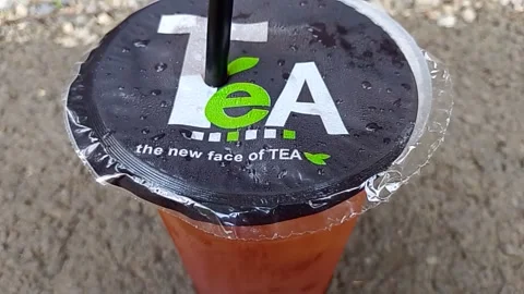 Central Java Indonesia October 16, 2025: sweet iced tea in a plastic cup. Video stock 320353861