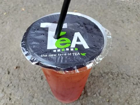 Central Java Indonesia October 16, 2025: sweet iced tea in a plastic cup. Фото