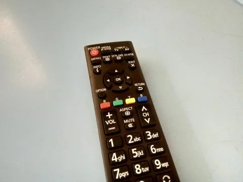 Central Java Indonesia October 2 2024: tv remote, over flat background.  Stock Photos