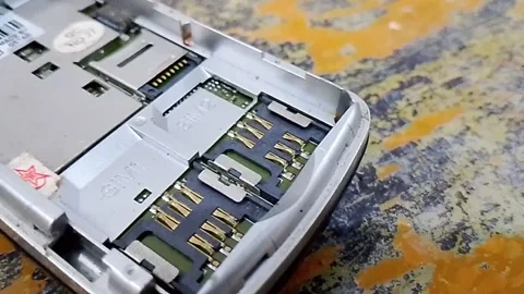 Central Java Indonesia October 21, 2025: Mobile phone sim card slot. Stock Footage 320678479