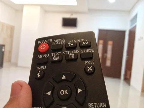 Central Java Indonesia October 3 2024: someone holding a television remote.  Fotos Stock