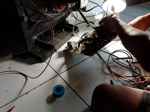 Central Java Indonesia October 7, 2025: an electronics technician is repairing a Фото