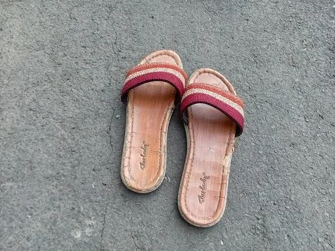 Central Java Indonesia October 8 2024: women's sandals on the asphalt. Fotos de archivo